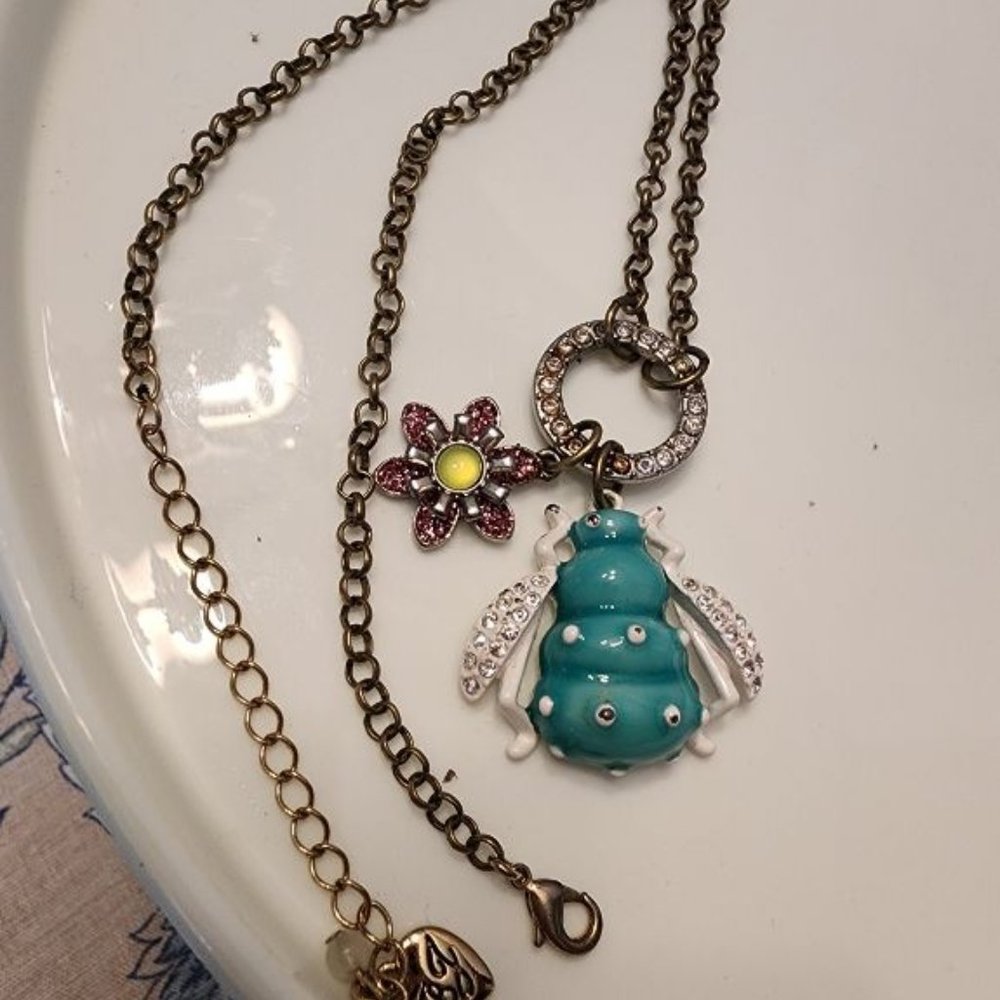 BETSEY JOHNSON CHARM NECKLACE WITH BLUE CRYSTAL BUG AND PINK FLOWER